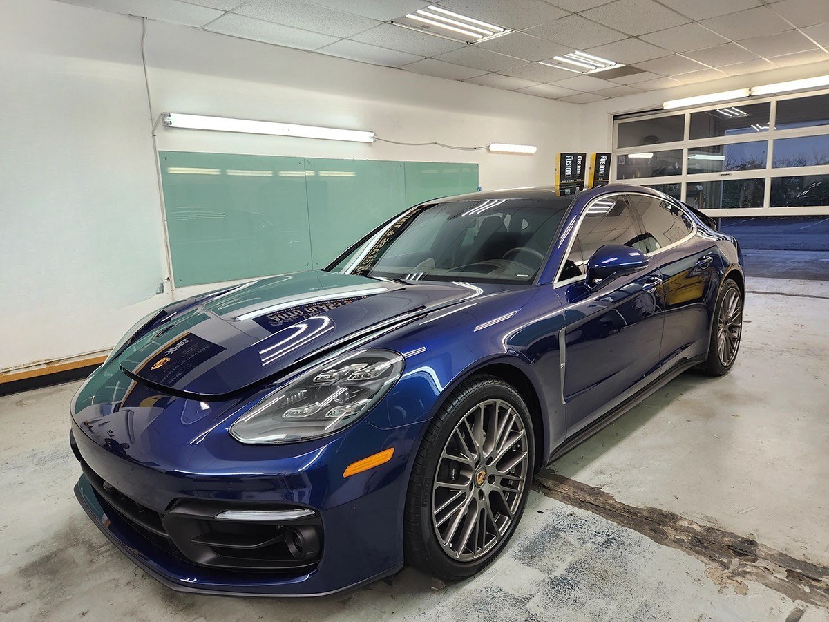 Vehicle inside a professional tint shop bay