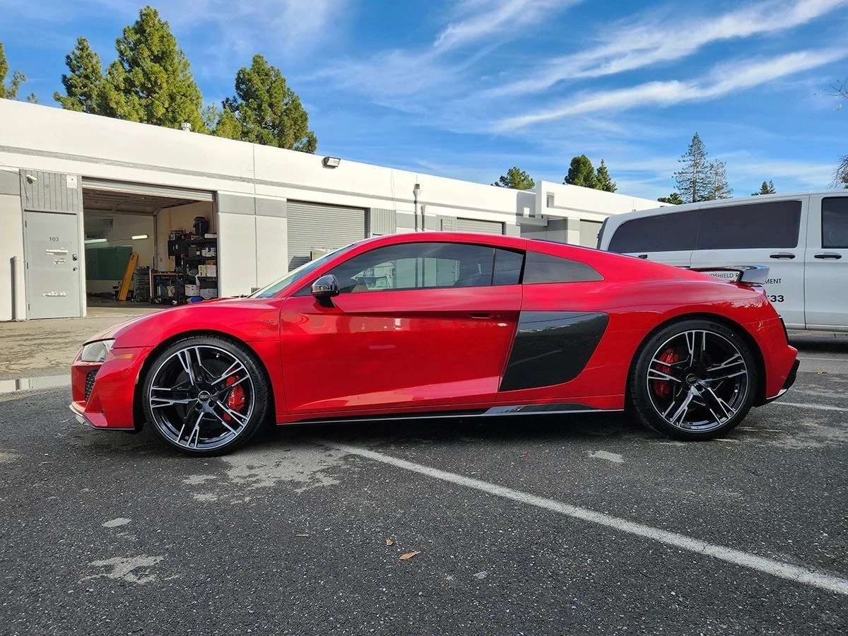 Car exterior with older tint being removed and replaced